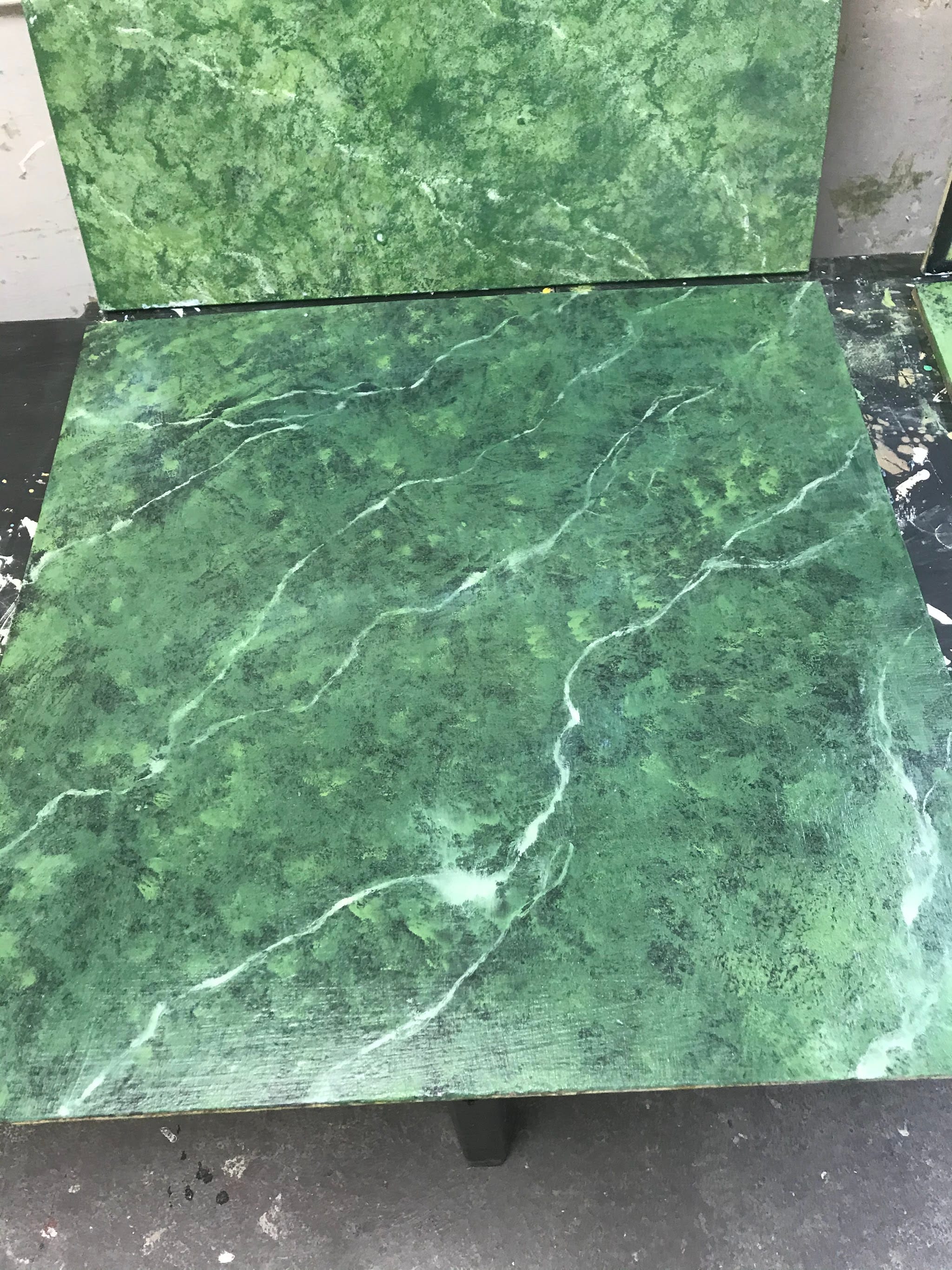 Two green marbled sample panels